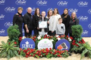 Addison Dwyre (Centre) alongside John den Haan and Naomi Lutes, Ontario 4-H Foundation as well as members of the Stewart family at a ceremony during the Royal Winter Fair in Toronto (Photo submitted by 4-H Ontario)